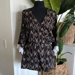 NWOT Romper with lace trim on sleeves